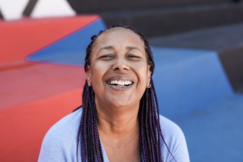 Happy african senior woman smiling on camera